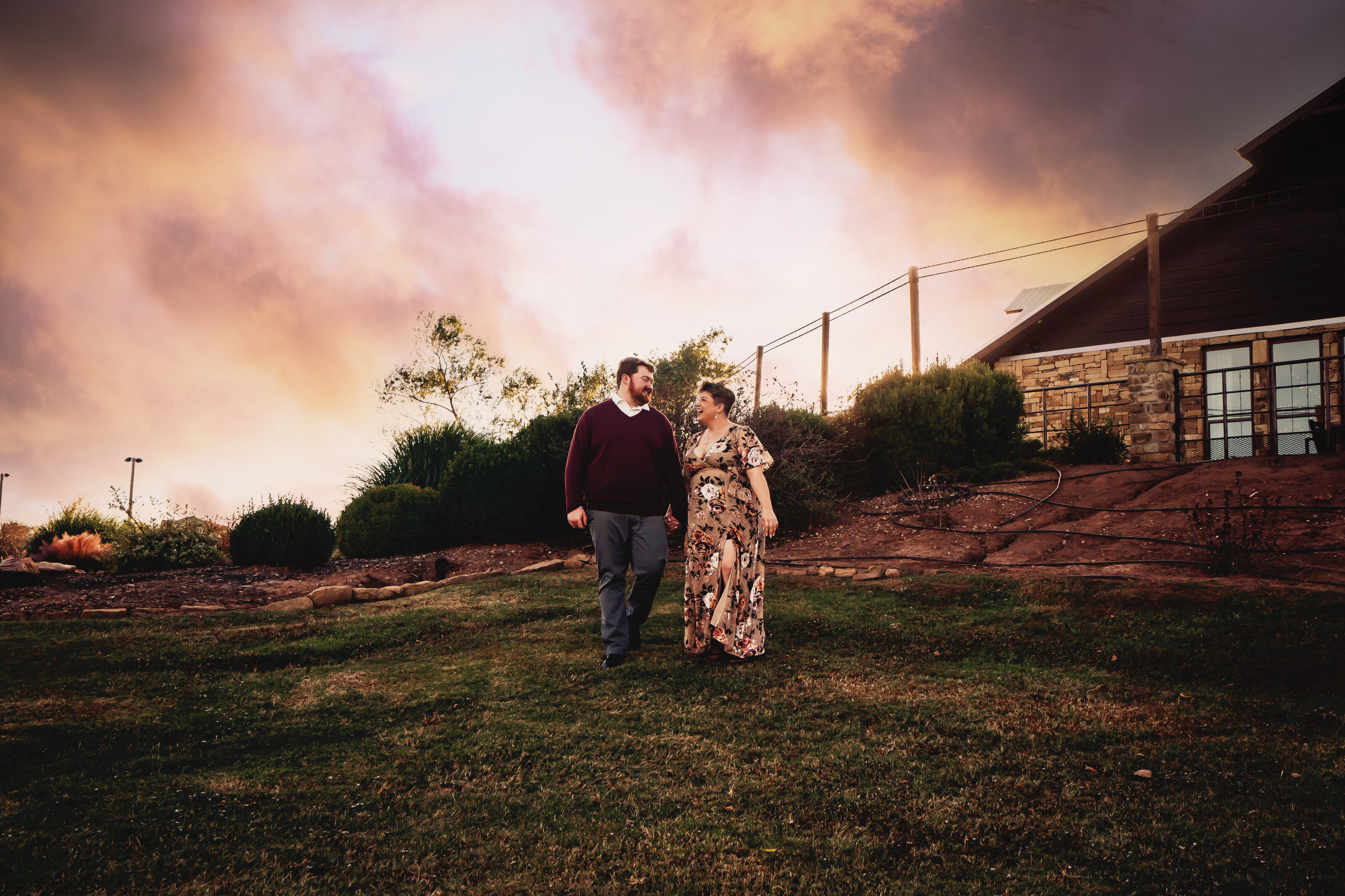 couple looking at each other walking at southwind hills photographer