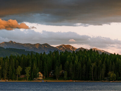 Sunset casting light on the mountains at a Glacier National Park wedding.