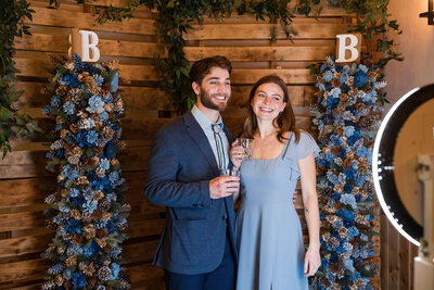 guests smiling during a photobooth at barnwood events in madison, winconsin.