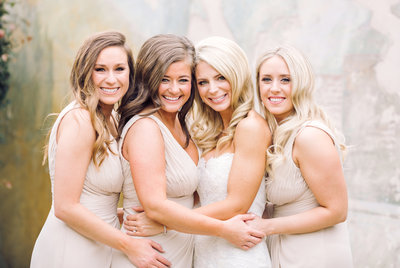 Wedding Photography, bride and bridesmaids standing together for a picture
