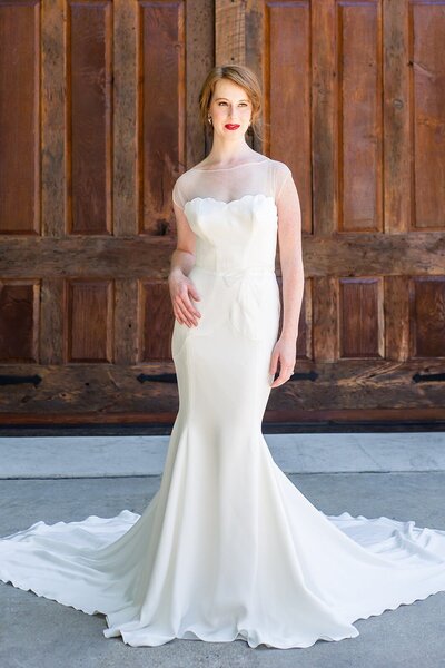 Link to more details and photos of the Zara crepe mermaid wedding dress style with its illusion neckline by Charleston bridal designer Edith Elan.