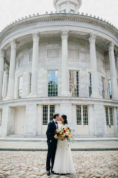 Portrait of a bi-racial couple on their wedding day in front of this iconic Philadelphia landmark.