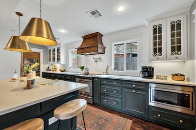 Beautiful open concept kitchen in this three-bedroom, two-bathroom vacation rental home featured on Chip and Joanna Gaines' Fixer Upper located in downtown Waco, TX.