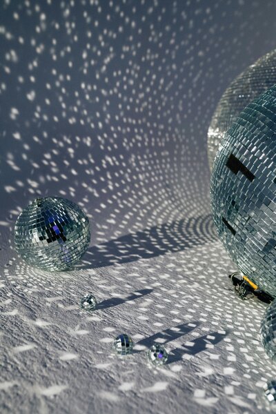 Grey disco balls shining