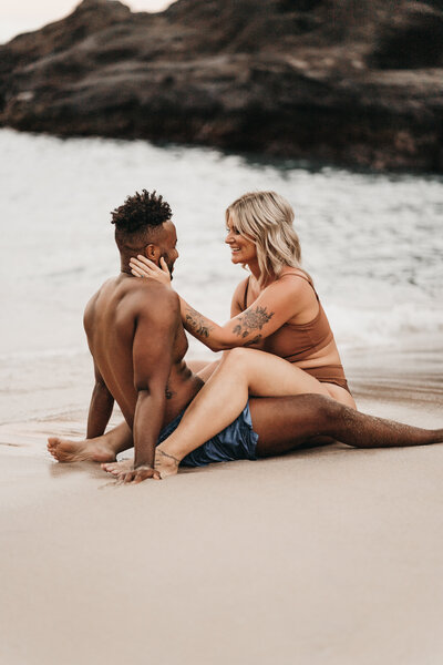 Couple share an intimate moment during their adventure session on Oahu.