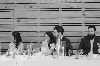 heartfelt moment of wedding details at Downtown Market reception area – West Michigan wedding photographer.