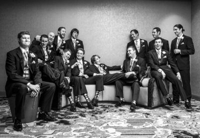 Black and white image of groomsmen hanging out together