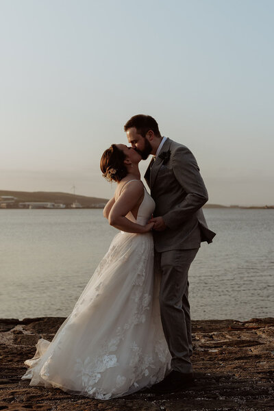 bride and groom coastal portrait