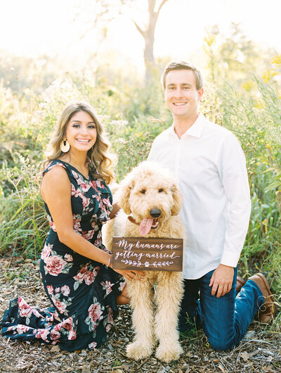 An outdoor engagement in the Texas Hill Country with their beloved Golden Doodle