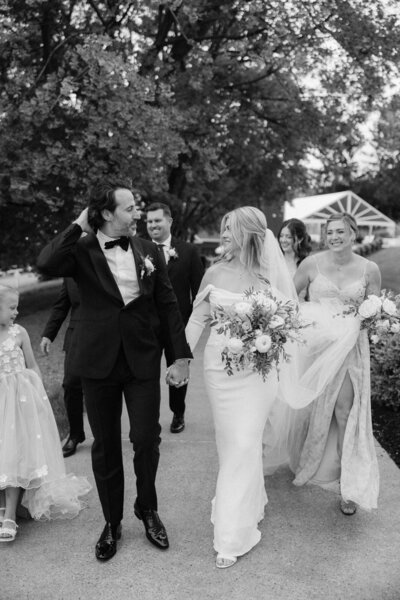 Bride and groom enjoy a fun moment together after their Finger Lakes wedding ceremony