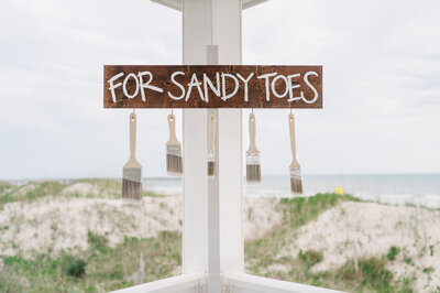 A beach wedding sign for Wilmington waterfront venues by JoLynn Photography