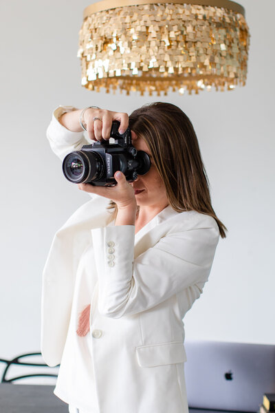 South Dakota wedding photographer Patty Solis taking photo with film camera
