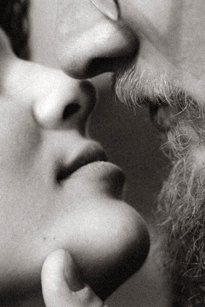 black and white close up photo of a couple's nose