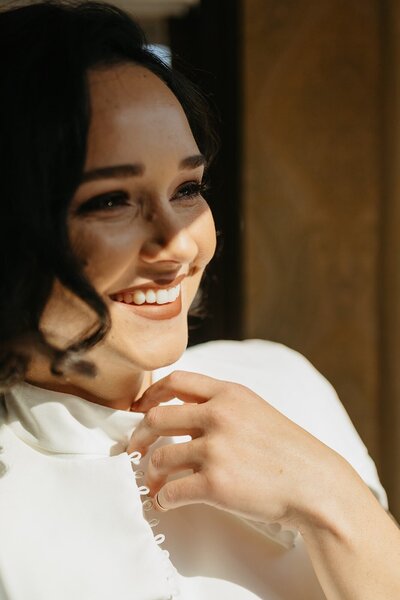 Bride Smiling in Window Light - Megan & Amber | Hood River Wedding  - LGBTQ Wedding
