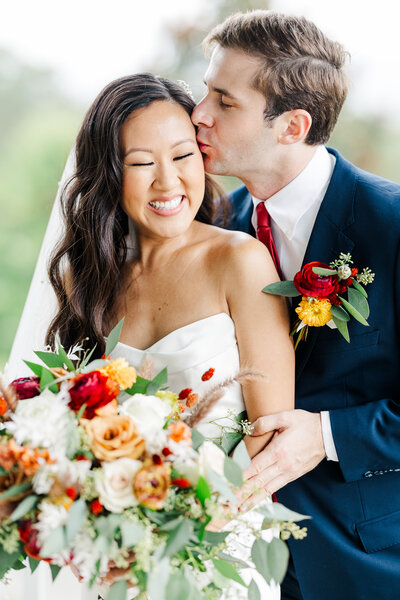 groom nuzzling bride's temple by Knoxville Wedding Photographer, Amanda May Photos