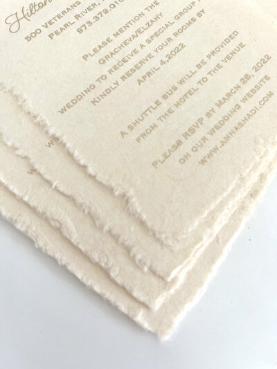 Deckled edges on soft handmade paper invitations