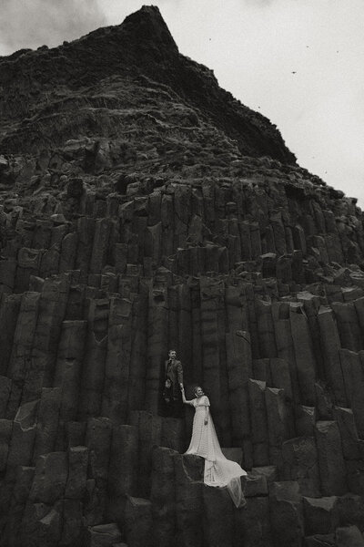 bride and groom on basalt columns Iceland