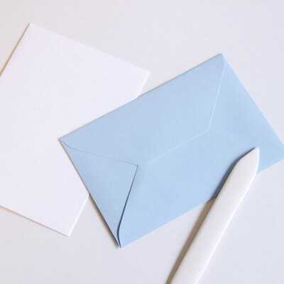 dusty blue envelope