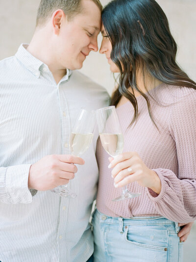 couple toasts with champagne