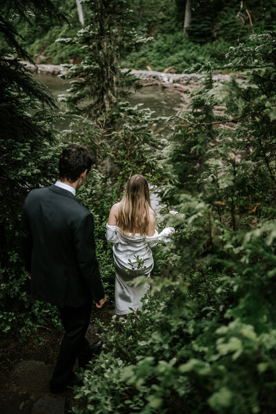colorado elopement photography in rocky mountain national park, bride and groom hiking