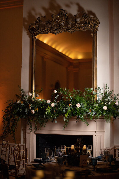 Mirror above fireplace with flowers in venue, Salem wedding