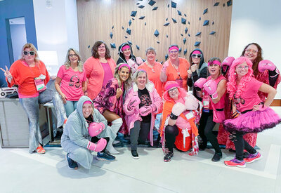 Group of woman wearing goofy pink outfits