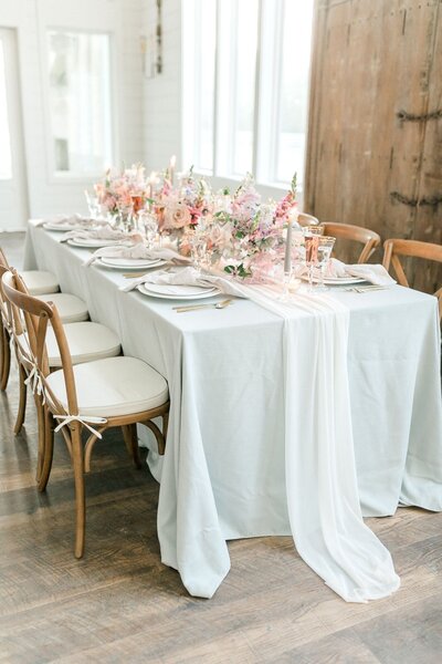 Wedding reception table with pink floral