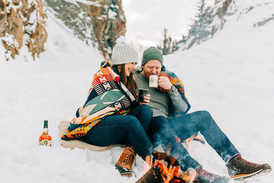 photo of couple by the fire