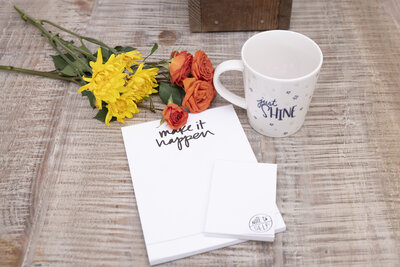 Bouquet of flowers with mug and pad of paper