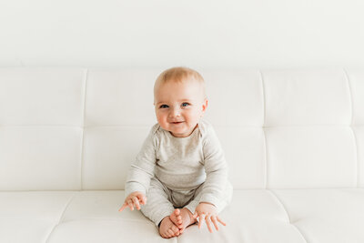 young toddler sitting smiling
