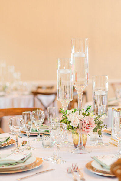 Neutral colored table settings at a wedding reception.