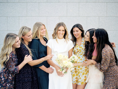 Bride with Bridesmaids laughing