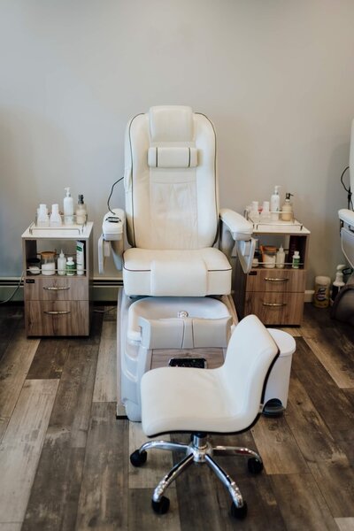 Nail'd It Beauty Lounge's individual client's comfortable white chair