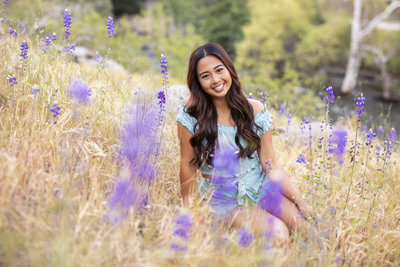 Senior Photography, girl sitting in a field of wildflowers