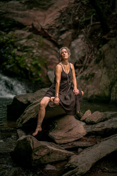Woman sitting on rocks