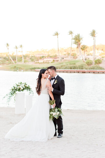 Bride and Groom kissing at Reflection Bay Lake Las Vegas Wedding