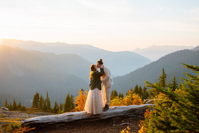 Couple kissing during sunset on Table Mountain near Mount Baker