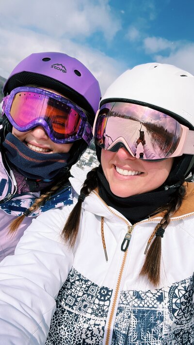 Mother and daughter snowboarders