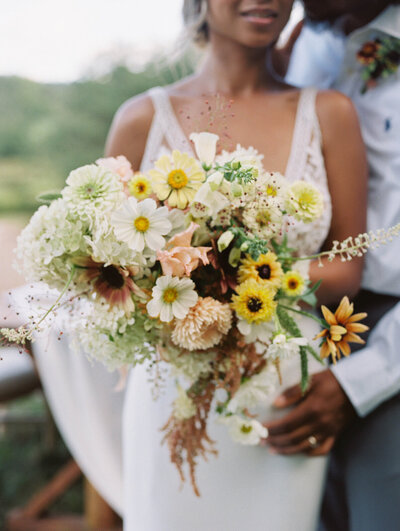 Couple gets married in a luxury elopement wedding outside of Stowe Vermont with local bridal bouquet
