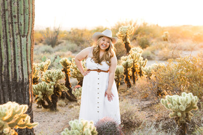 high school senior girl poses for Scottsdale senior photographer in the desert