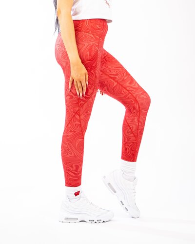 Model wearing red game day patterned leggings