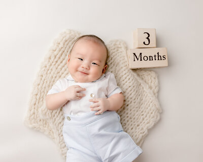 three month old baby boy in portland studio for milestone photography session with Ann Marshall Photography