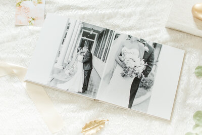 photo album spread with black and white wedding photos