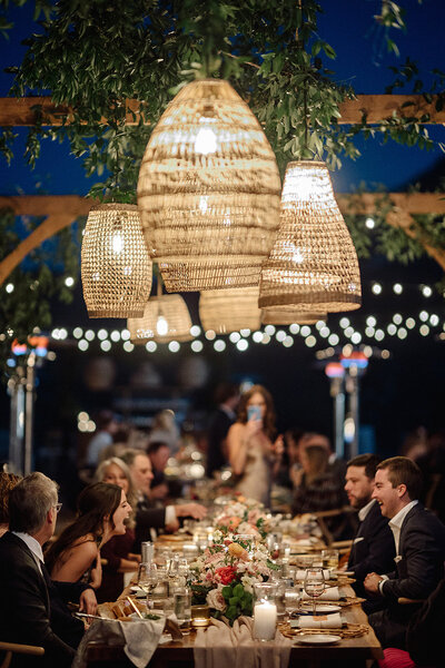 alfresco wedding dinner with hanging lanterns