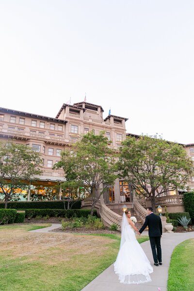 bride and groom walk the grounds of The Langham Hotel in Pasadena