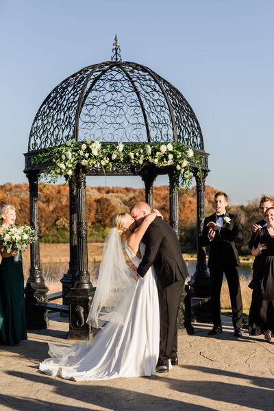 Couple share first kiss during outside ceremony