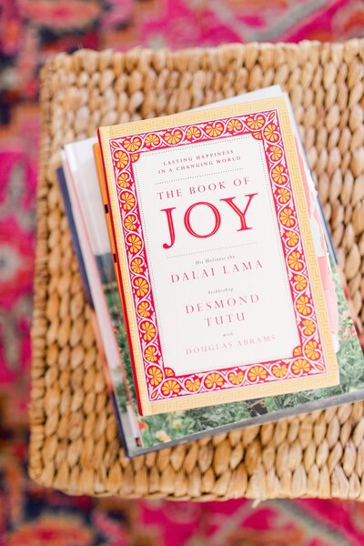 Priscilla Baierlein's favorite book, The Book of Joy, sitting on a basket.
