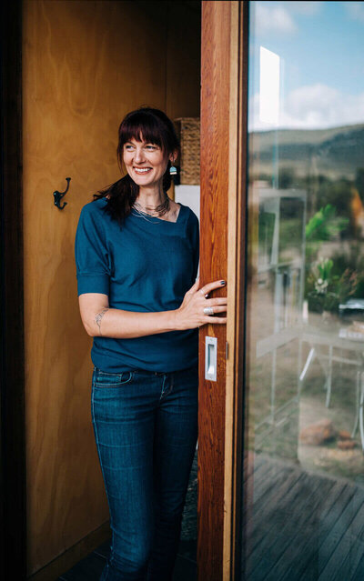 Sara Bowers standing in doorway smiling
