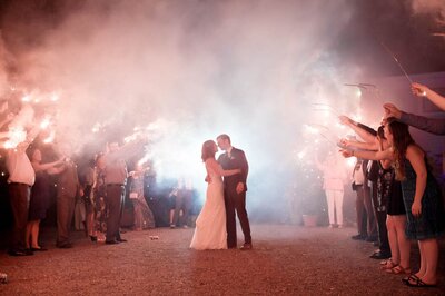 a smoky sparkler exit at the end of the wedding at ainsworth house