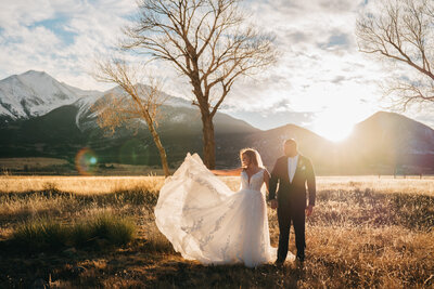 Wedding Photos of a couple with golden light at the Barn At Sunset Ranch in Buena Vista Colorado